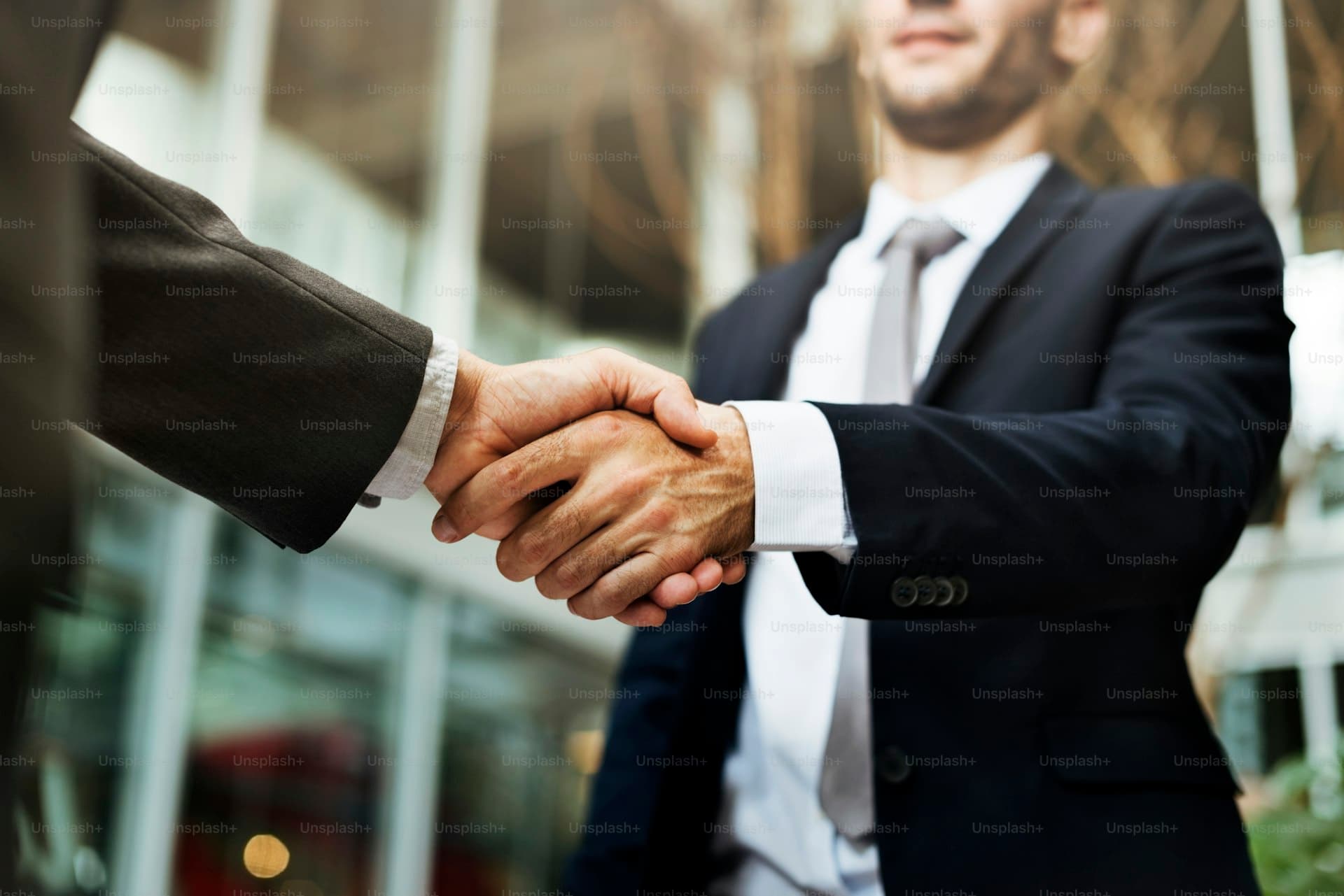 Business agreement handshake representing transparent pricing