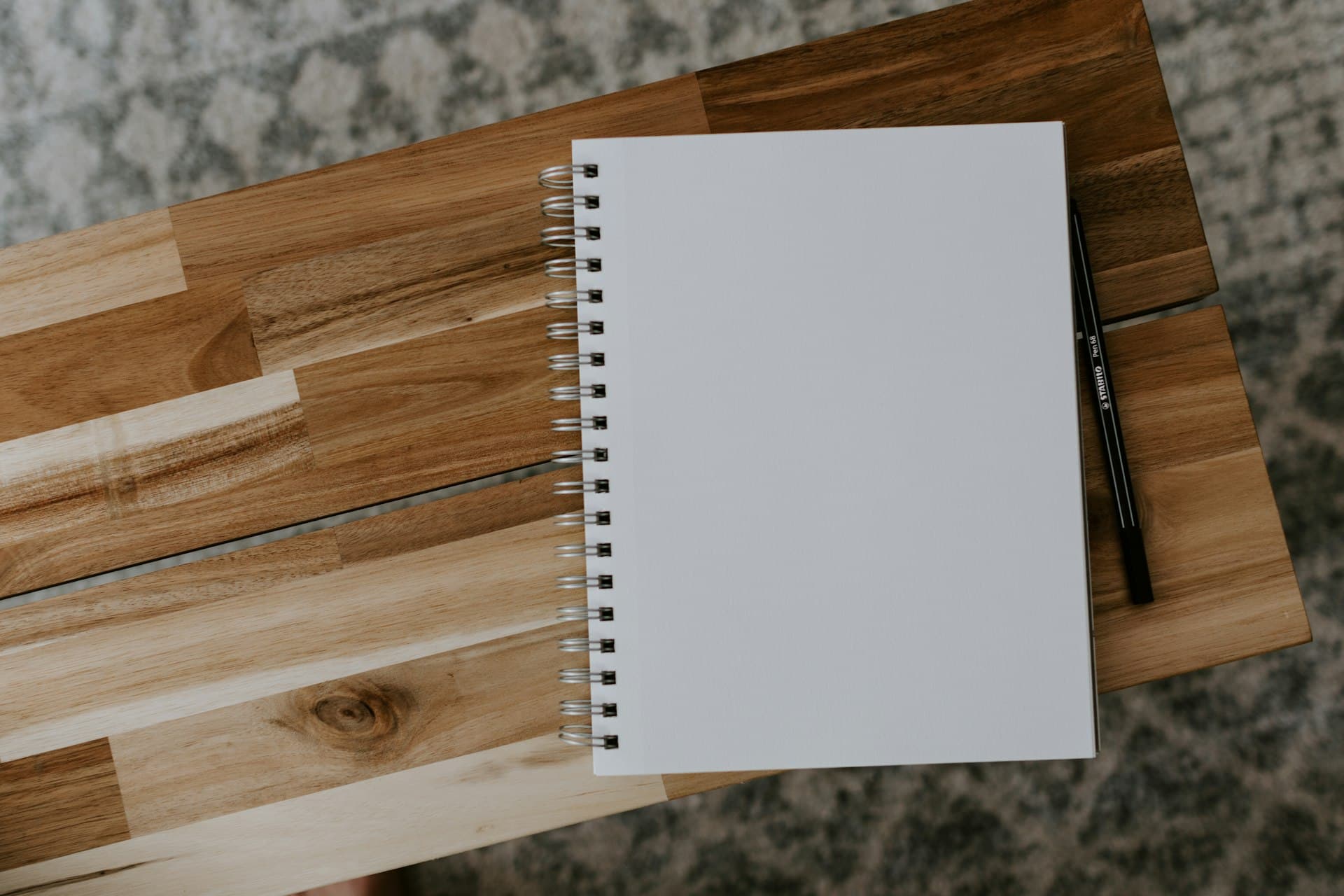 Notebook and pen representing expungement guides and resources